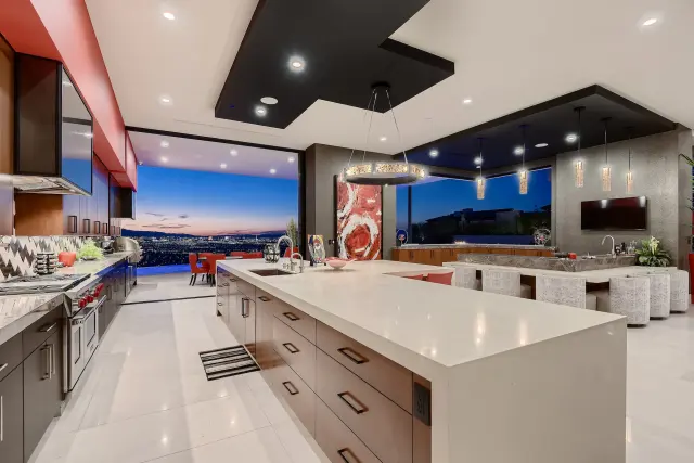 Remodeled Henderson kitchen with stone island and integrated appliances